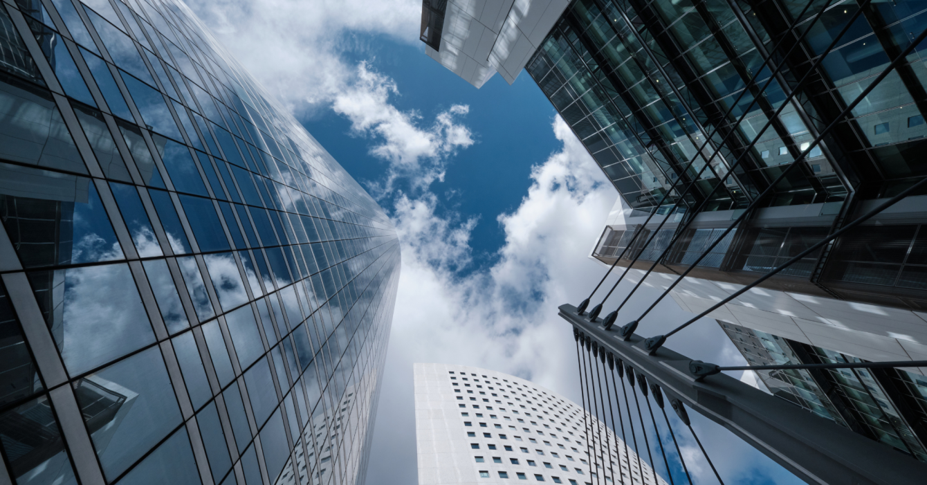 ESG: The Risks & Rewards for Real Estate Portfolio Owners A picture of big skyscraper buildings